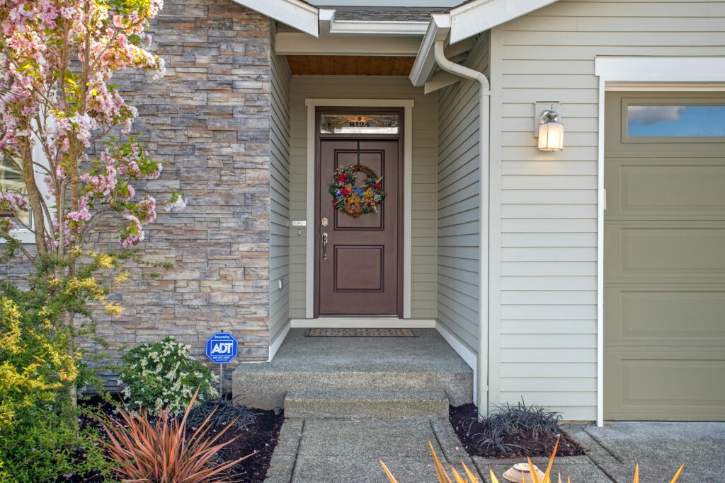 Photograph of a House with a Brown Door